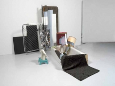 Jessica Stockholder, 2000, 2000, couch, photographs, metal gate, plywood, two lamps, bathtub, fish tank, fan, stool, embroidery thread, fake fur, extension cord, metal, acrylic paint, and metal bracket, 82 &frac12; &times; 84 &times; 128 in.